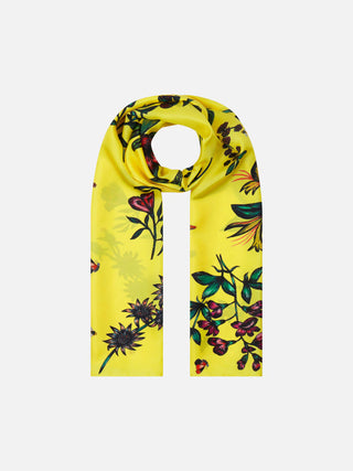 Floral yellow silk scarf in neck wrap style on a flat lay